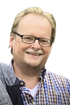 Portrait eines lächelnden Mannes.